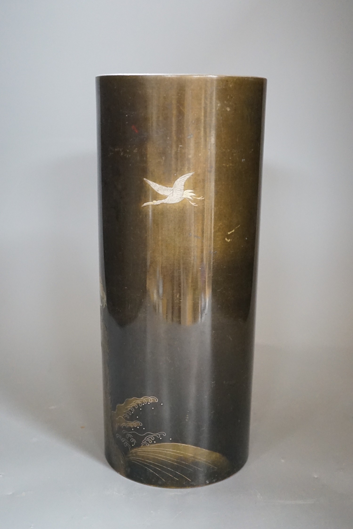 A Japanese mixed metal inlaid bronze cylindrical vase, Meiji period, 30cm